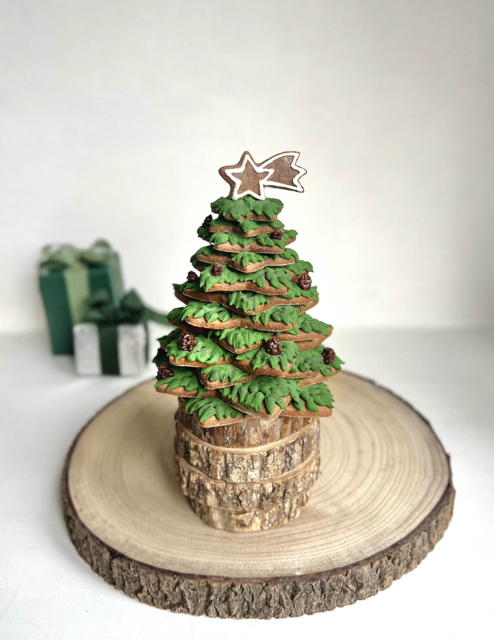 Gingerbread Christmas trees decorated with green icing and handmade pine cones