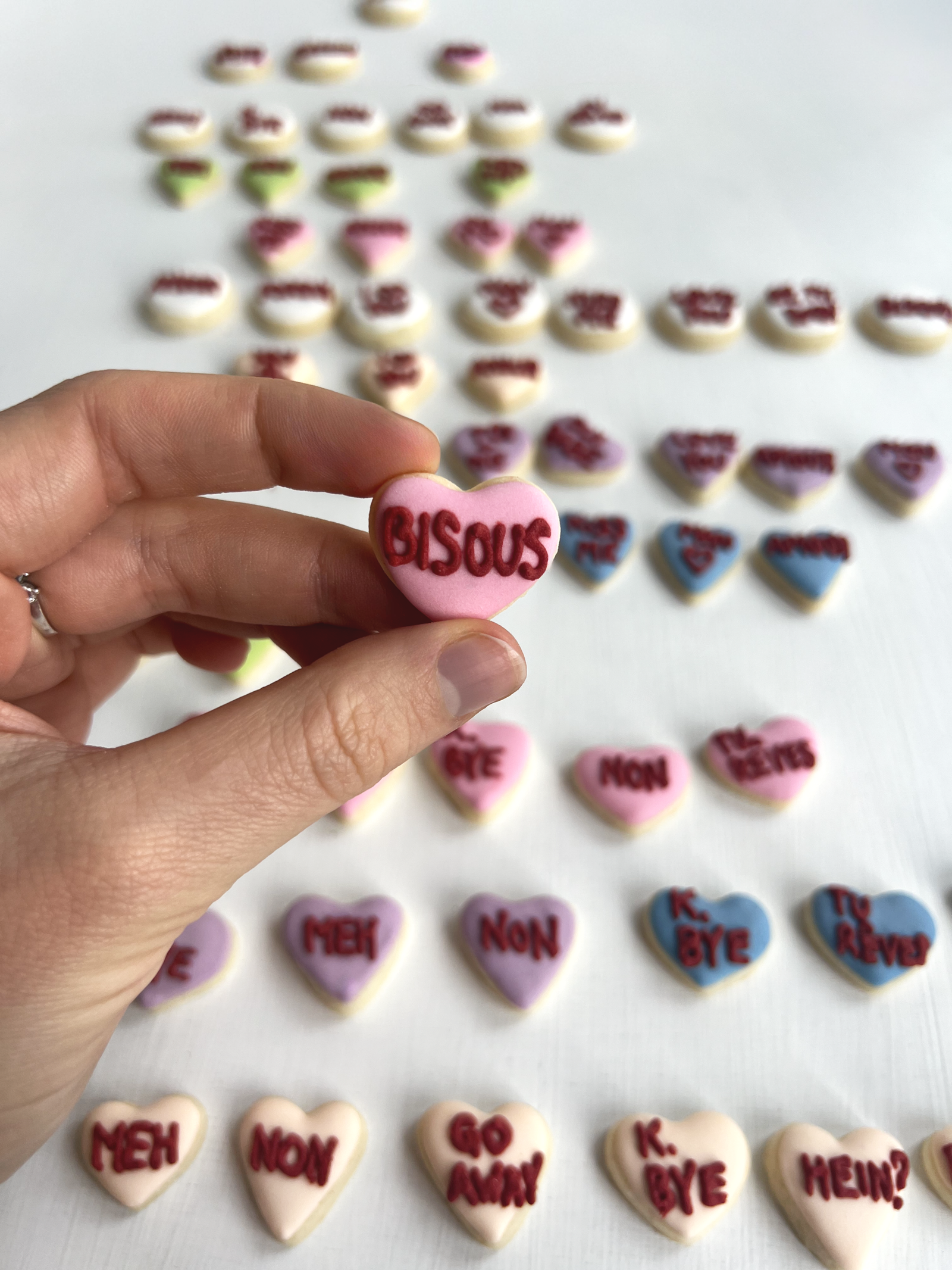 Hero arrangement of sugar cookies with heart cut-outs and sweet wording.
