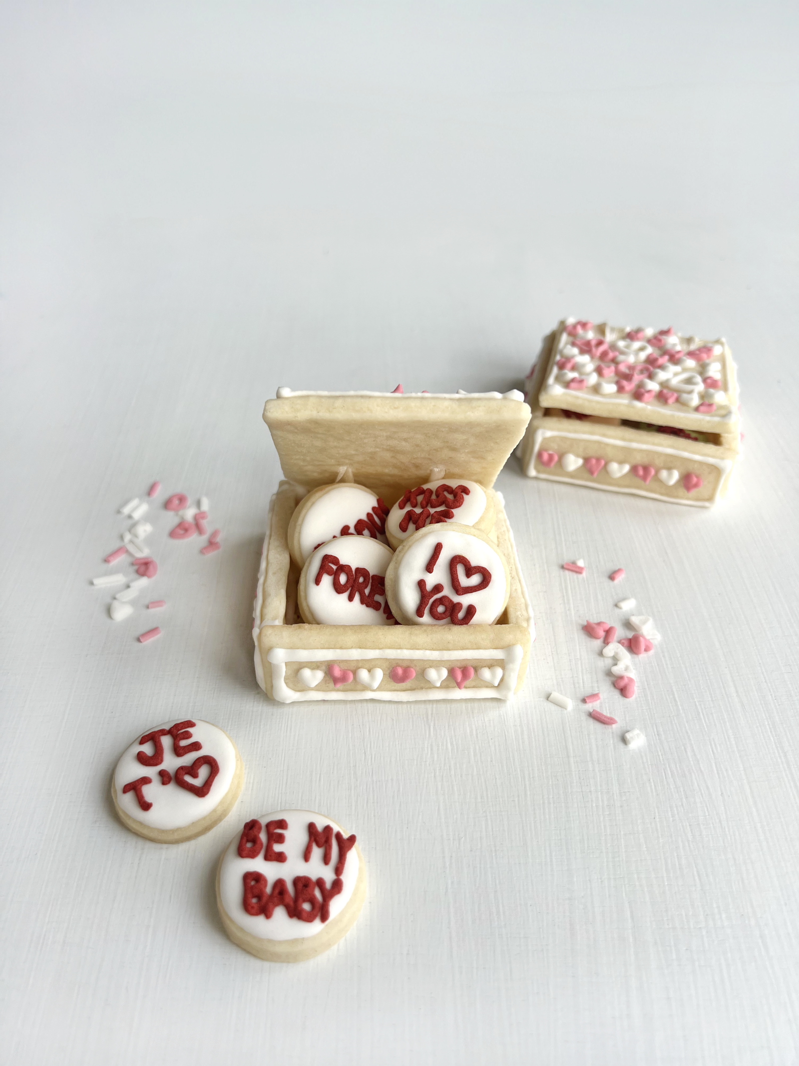 Hero arrangement of sugar cookies with heart cut-outs and sweet wording.
