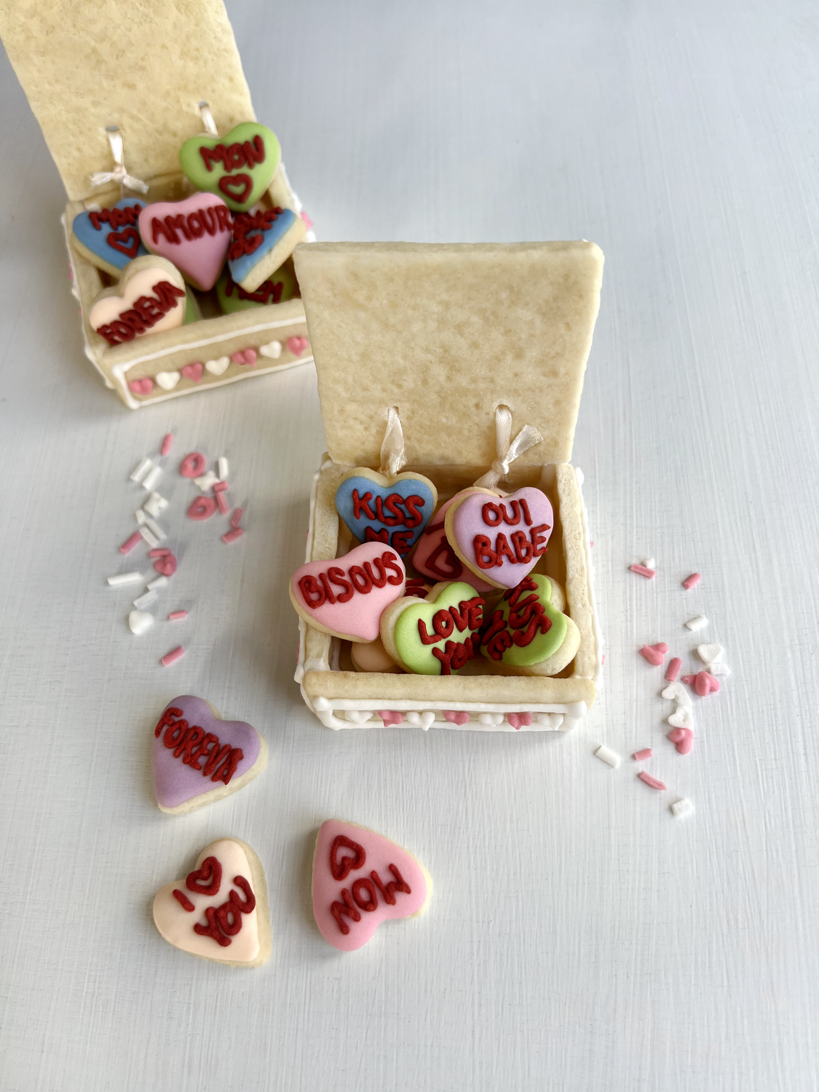 Hero arrangement of sugar cookies with heart cut-outs and sweet wording.