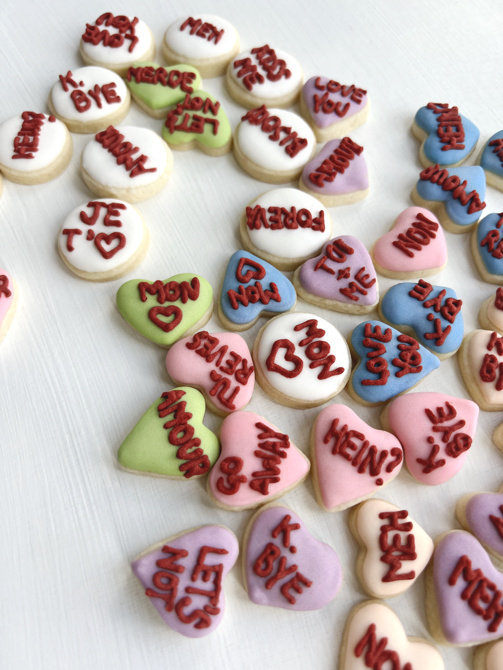Hero arrangement of sugar cookies with heart cut-outs and sweet wording.
